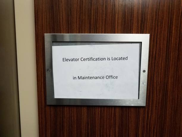 istock paper elevator certification is located in maintenance office sign 1193698663