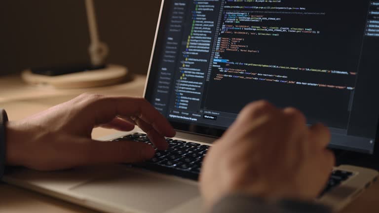 Man's Hands Coding on Laptop  CLOSE UP. Man using portable computers. Man programmer writes code