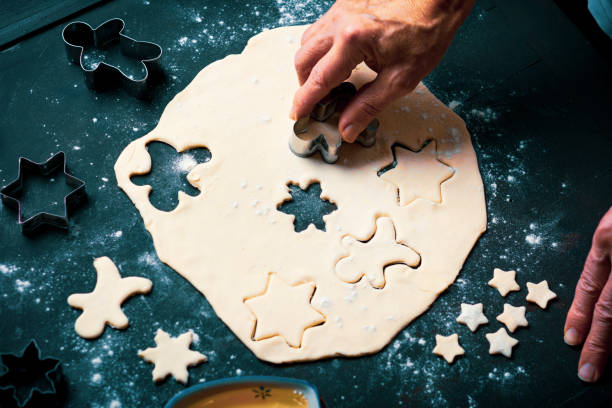istock Man making a festive decorated pastry at home 1193700138