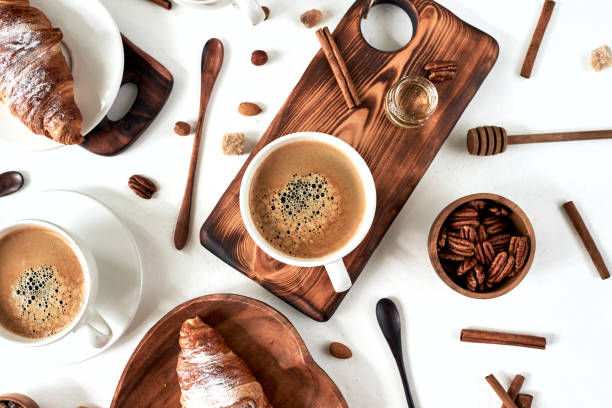 istock breakfast pattern, croissant, coffee, honey, cinnamon sticks, nuts, sugar. Good morning concept. 1193700363