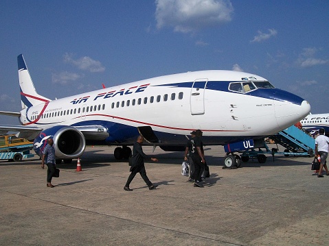 Scene Of People Walking, Boarding Air Peace Passengers Airplane At Sam Mbakwe International Airport In Owerri Imo State Nigeria West Africa