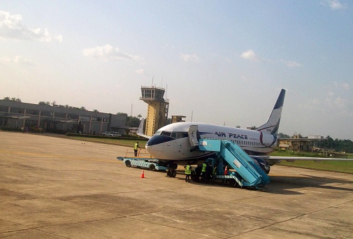 Scene Of Land Vehicle, Air Traffic Control Tower, Ground Crew Preparing To Unload Air Peace Airplane Passengers Goods After Arrival At Sam Mbakwe International Airport In Owerri Imo State Nigeria West Africa