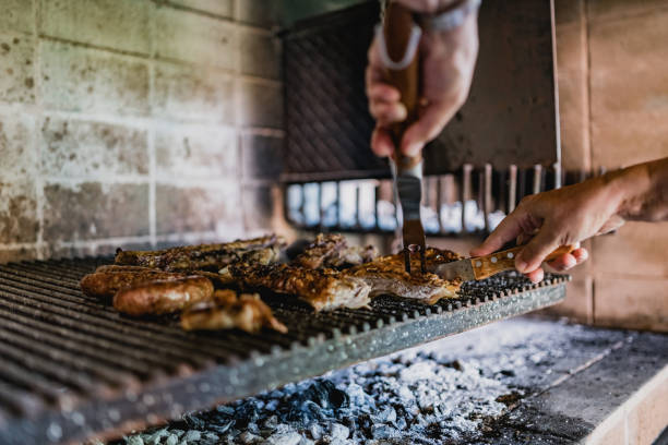 istock Senior man barbecue meat at home 1193701720