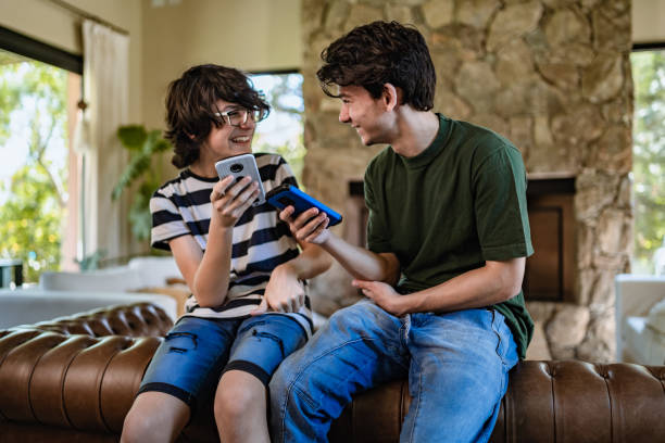 Teenagers playing on a smart phone