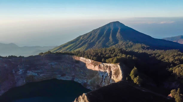 istock Kelimutu - Volcanic lake hiding under the clouds 1193703705