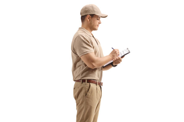 istock Delivery guy writing in a clipboard 1193704216