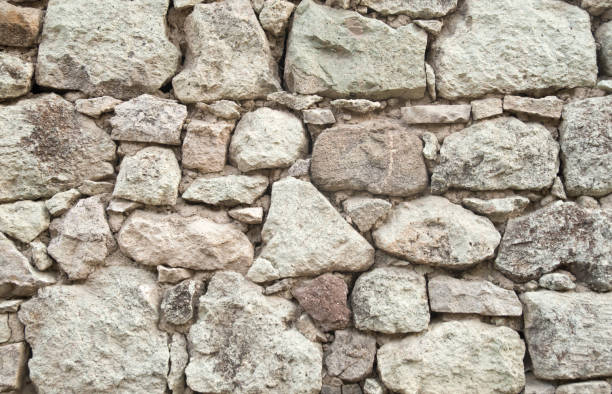 istock Old stone wall  closeup in sunny day 1193708857