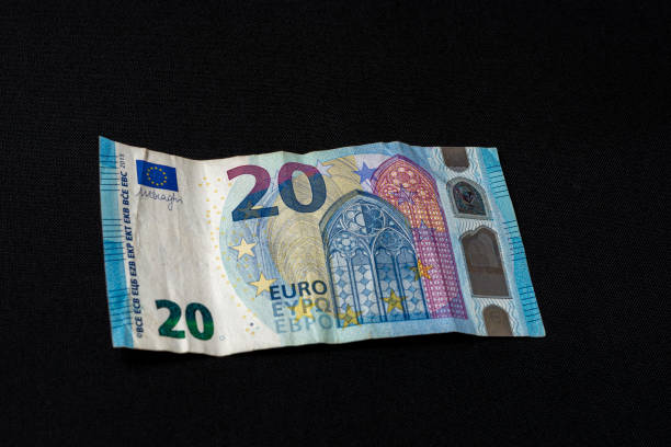 istock Twenty memorable euros lie on a black background. 1193709335