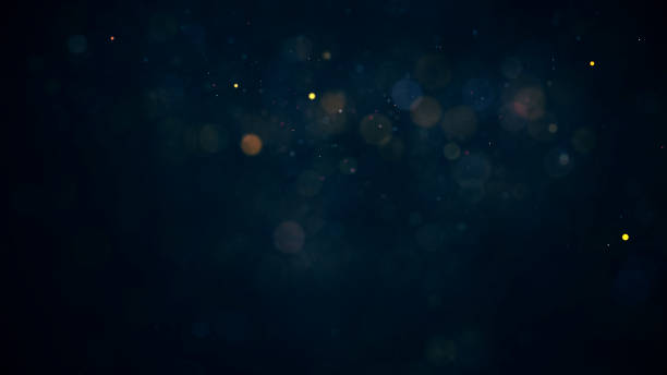 istock holiday background with coloured glowing particles 1193709922