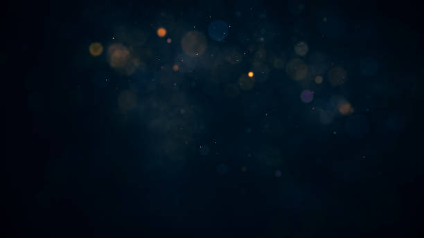 istock holiday background with coloured glowing particles 1193709926