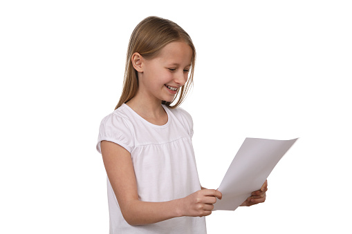 Young girl with long hair holds a paper