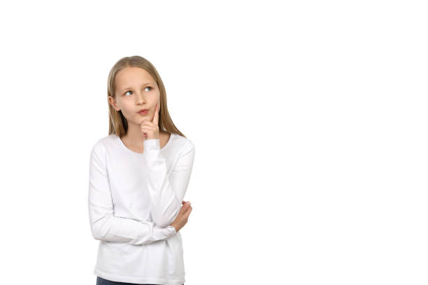 istock Little girl is thoughtful against a white background 1193710495