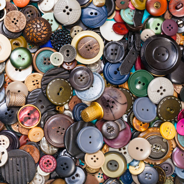 istock heap of many various buttons close up on blue 1193711641