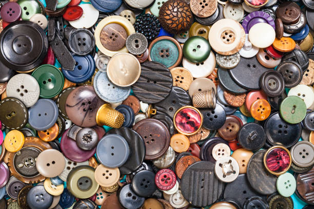istock heap of many different buttons close up on blue 1193711653
