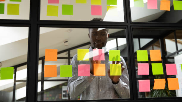 istock Focused millennial african american male manager organizing working process. 1193713012