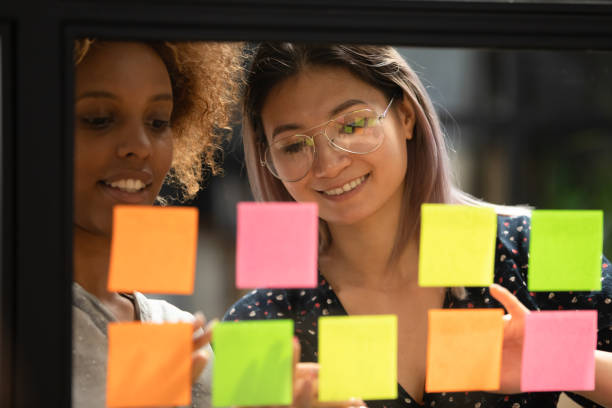 istock Close up head shot smiling multiracial colleagues working at office. 1193713014
