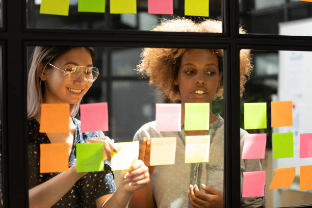 istock Happy vietnamese employee working with concentrated african american trainee. 1193713016