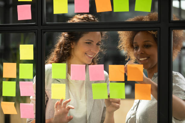 istock Team leader working together with african american millennial project manager. 1193713023
