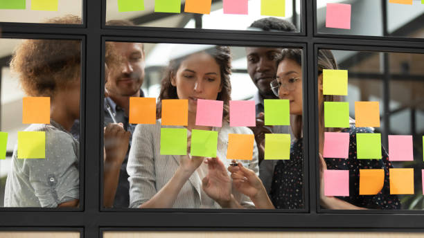 istock Focused young diverse teammates working with caucasian team leader. 1193713027