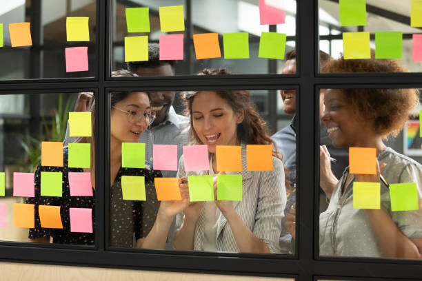 istock Diverse teammates satisfied with working process at office. 1193713033