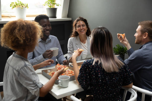 istock Overjoyed group of mixed race colleagues having fun on friday. 1193713066