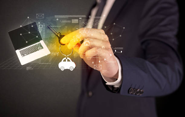 istock Businessman holding keys with graphs around 1193713209
