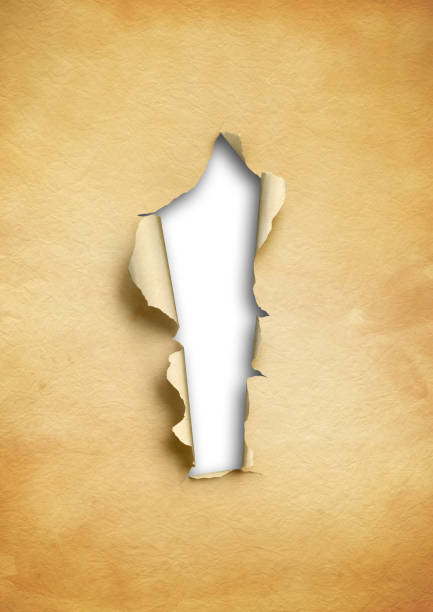 istock Old torn parchment paper with hole 1193713311