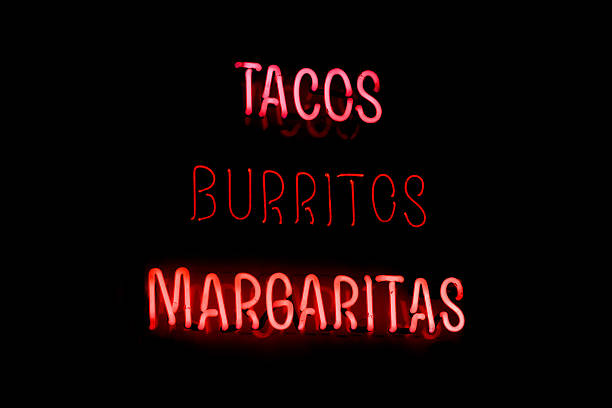 Tacos Burritos Margaritas neon sign stock photo