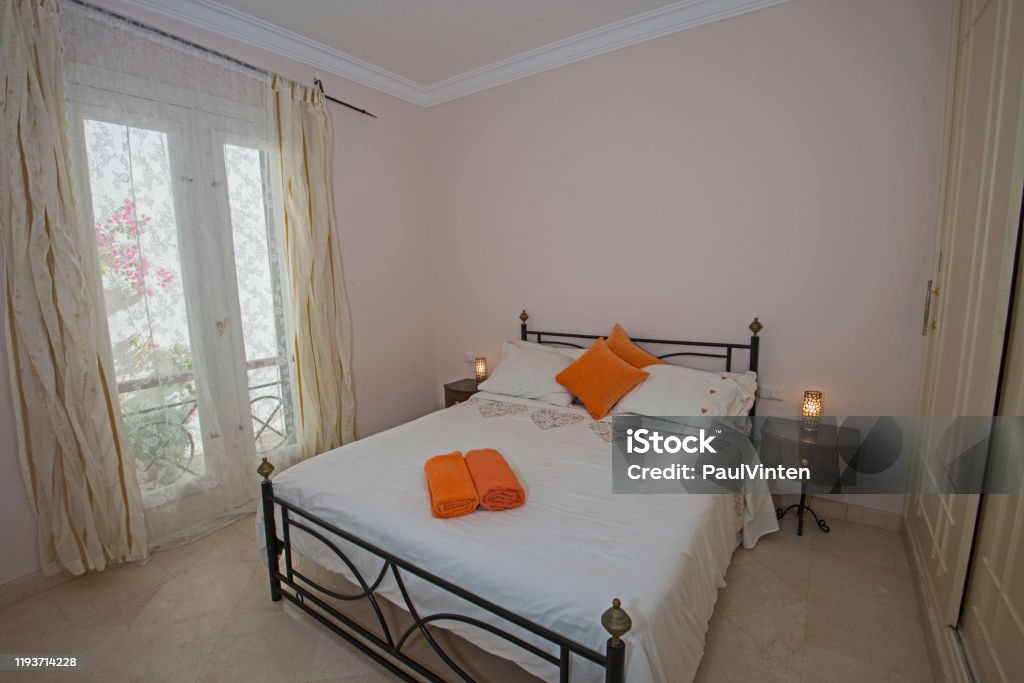 Interior design of double bedroom in house Interior design decor furnishing of luxury show home double bedroom with furniture Bed Frame Stock Photo