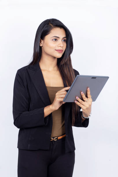 istock Beautiful Indian businesswoman using digital tablet on white background 1193717094