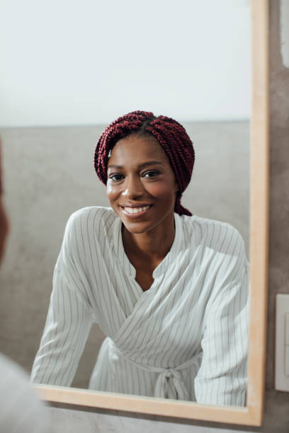 istock Woman Looking at Mirror 1193717248
