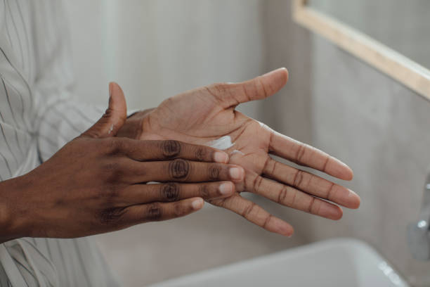 istock Woman Applying Hand Cream 1193717258