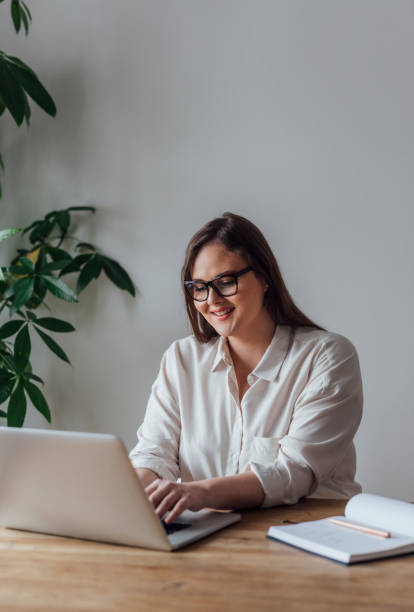 istock Businesswoman Working on her Laptop 1193720786