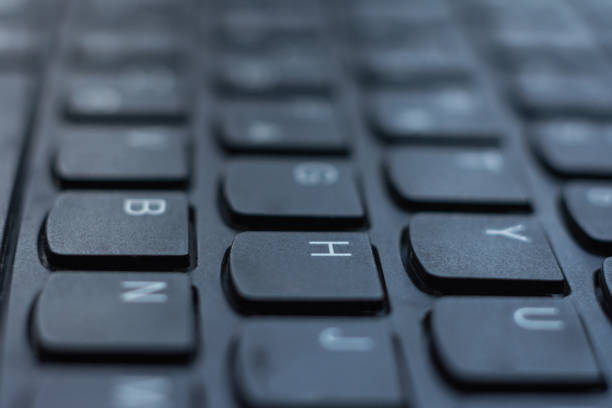 istock Modern black laptop keyboard closeup, english alphabet. 1193721014