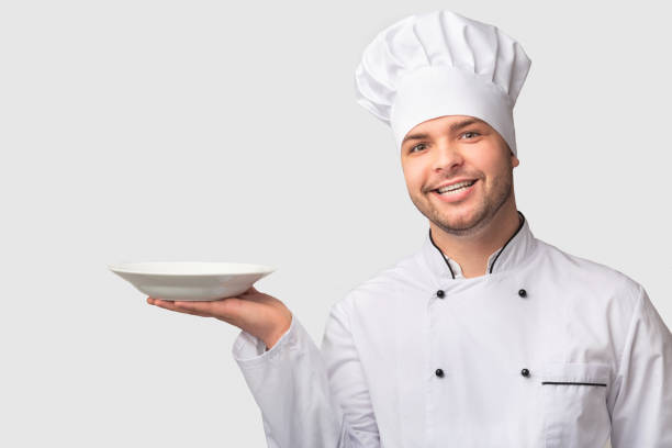istock Chef Man Holding Empty Plate Smiling Standing Over White Background 1193721068
