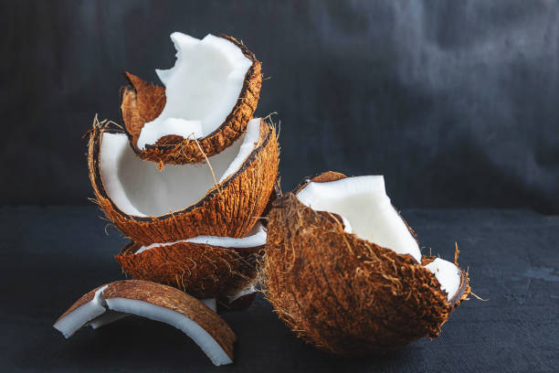 istock Coconut cut in half on a black background 1193721499