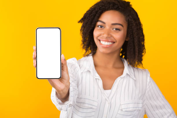 istock Happy black girl showing white mobile screen 1193723925