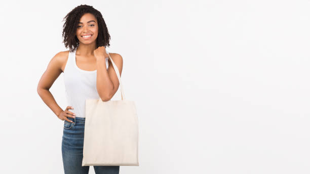 istock Afro woman with blank eco sack on white background 1193724353