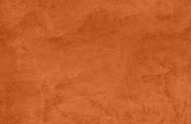 istock orange colored low contrast Concrete textured background 1193725608