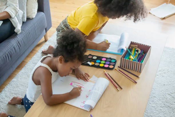 istock High Angle View Of Girls Drawing On Table 1193728989