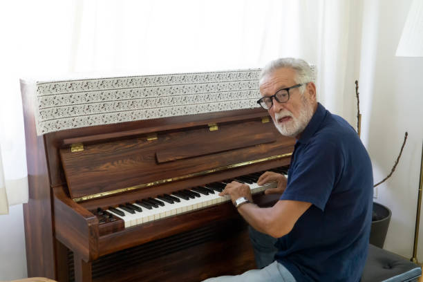 istock Senior Man Playing Piano 1193730264