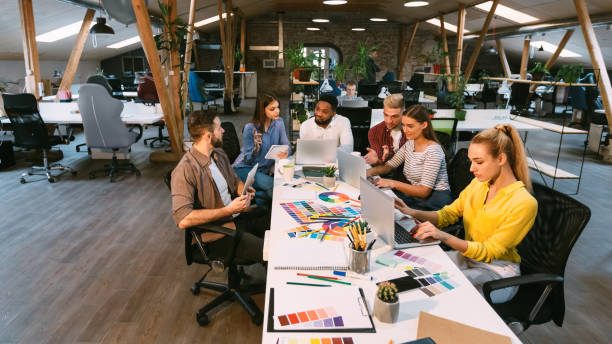 istock Coworking process. Designers working with project in office 1193730907