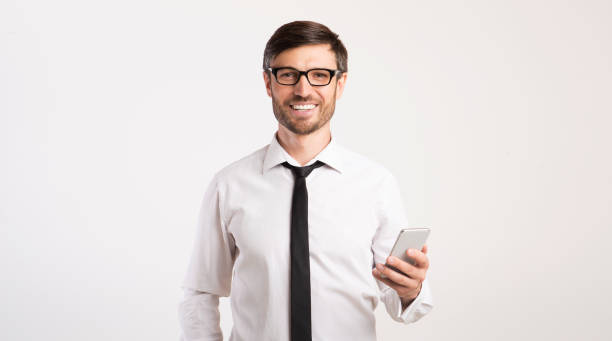 istock Smiling Man Using Mobile Phone Standing Over White Background, Panorama 1193731115