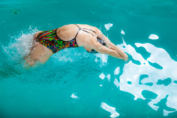 istock Swimming woman in pool. 1193733557