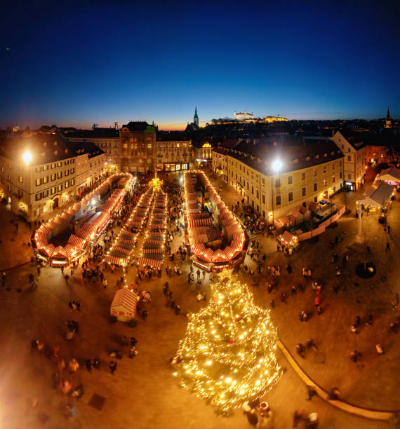 Night aerial panorama of Christmas market on Main Square (Hlavne namestie) in old town Bratislava, Slovakia. Overhead aerial view of Christmas market, Bratislava bratislava photos stock pictures, royalty-free photos & images