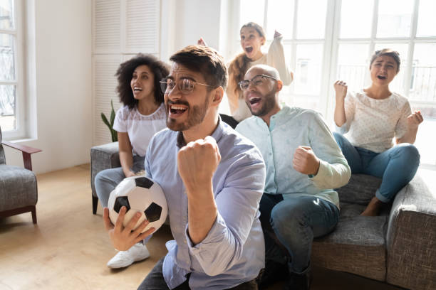 istock Euphoric young man in eyewear celebrating goal. 1193735027