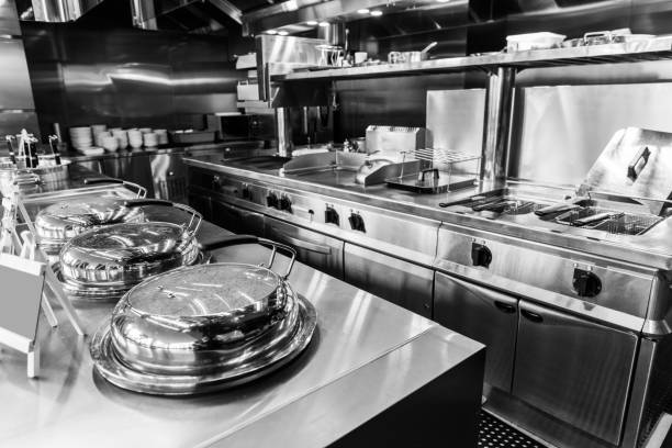 Commercial kitchen with stove and tools Commercial kitchen with stove and tools. indoors restaurant hotel work tool stock pictures, royalty-free photos & images