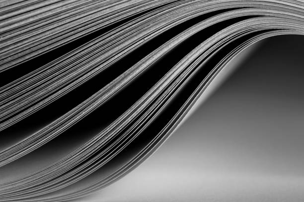 Closeup background of a pile of old magazines