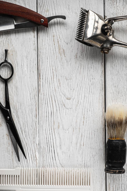 istock vintage barber tools dangerous razor hairdressing scissors old manual clipper comb shaving brush. vertical 1193738885
