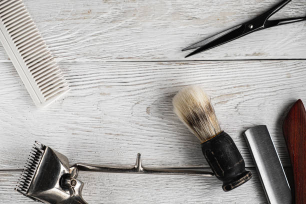 istock vintage barber tools dangerous razor hairdressing scissors old manual clipper comb shaving brush. 1193739405